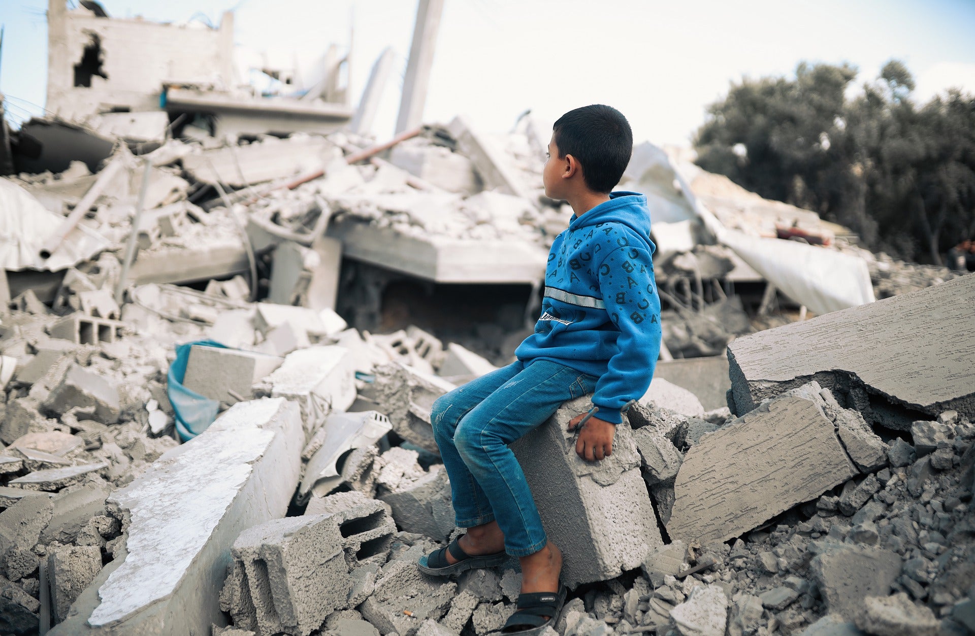 Boy Sitting on Stone